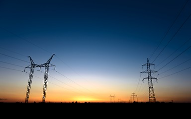 Image showing Large transmission towers at blue hour 