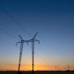 Image showing Large transmission towers at blue hour 