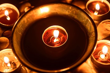 Image showing Candles burning at altar