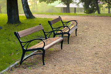 Image showing Stylish bench in autumn park