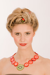Image showing Hot blonde with strawberry / kiwi chain