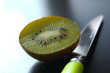 Image showing Eating kiwi