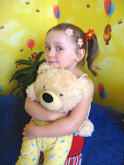 Image showing girl playing with her bear toy in her room