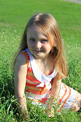 Image showing portrait of little girl lying on the grass