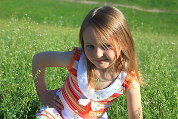 Image showing portrait of little girl lying on the grass