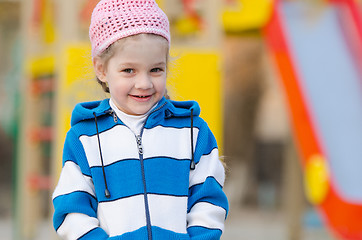 Image showing Portrait of cheerful four-year girl in playground