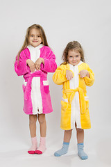 Image showing Two girls in gowns depict bunnies