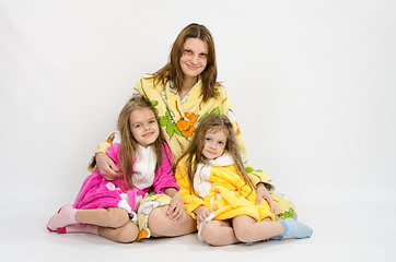 Image showing Mom with two daughters in bath robes