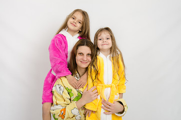 Image showing Portrait of a mother and two daughters in bath robes