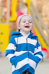 Image showing Four-year girl laughing in the playground