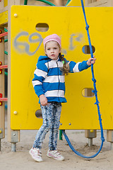 Image showing Worried little girl playing on the playground