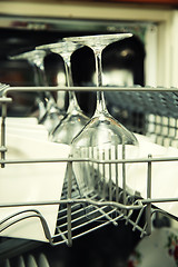 Image showing details of Open dishwasher with clean utensils