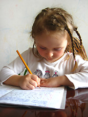Image showing girl learning her home tasks