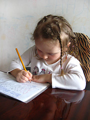 Image showing girl learning her home tasks