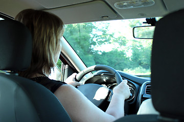 Image showing Young woman driving the car