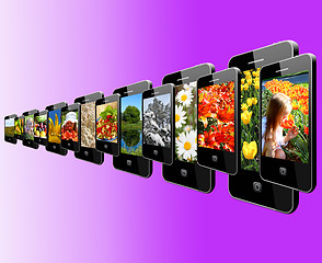 Image showing Modern mobile phones with different images