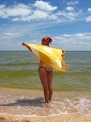 Image showing girl standing at the seacoast