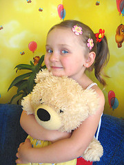 Image showing girl playing with her bear toy in her room
