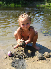Image showing little girl is playing at the river