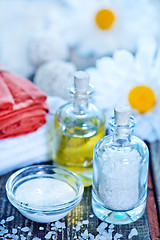 Image showing sea salt and oil in bottles