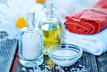 Image showing sea salt and oil in bottles