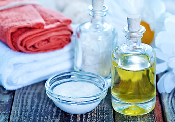 Image showing sea salt and oil in bottles