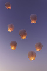 Image showing Sky lanterns flying upwards\r