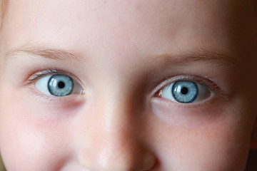 Image showing teen's blue eyes staring up