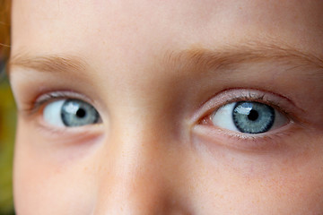 Image showing teen's blue eyes staring up