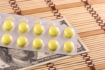 Image showing Pills and american money close-up background