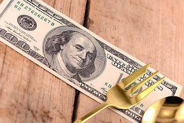 Image showing american money on wooden plate with knife and fok