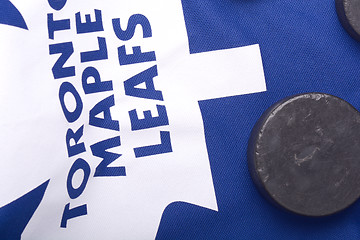 Image showing KHARKOV UKRAINE JANUARY 22: Toronto Maple Leafs jersey and old hockey puck