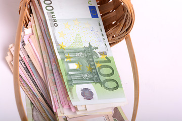 Image showing european money on wooden basket, dollars, euro