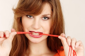 Image showing Woman with chewing gum