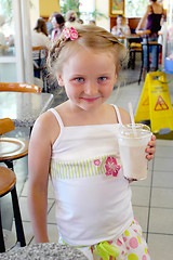 Image showing beautiful girl having dinner in cafe