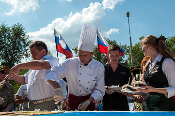 Image showing A cake in the shape of the flag of Russia