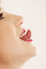 Image showing Woman sticking out tongue