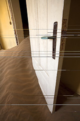 Image showing door in sand