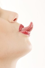 Image showing Woman sticking out tongue