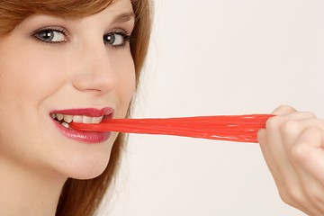 Image showing Woman eating gum