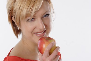 Image showing Woman eating apple