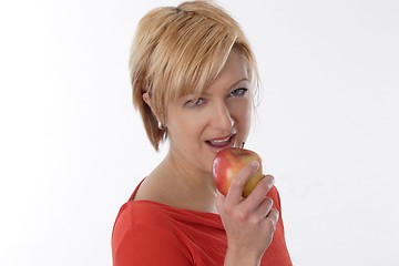 Image showing Woman eating apple