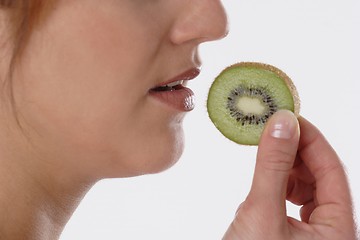 Image showing Woman with kiwi