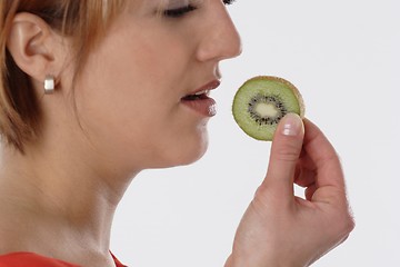 Image showing Woman with kiwi