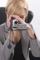 Image showing Businesswoman with video camera