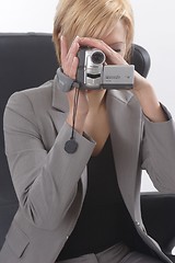 Image showing Businesswoman with video camera