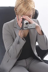 Image showing Businesswoman with video camera