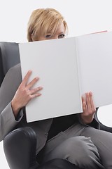 Image showing Businesswoman reading book