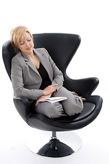 Image showing Businesswoman sitting on chair