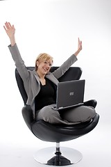 Image showing Businesswoman jubilant with laptop